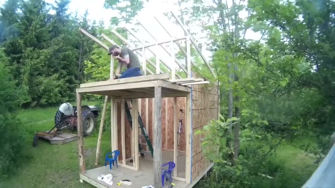 Kids playhouse with porch and loft.