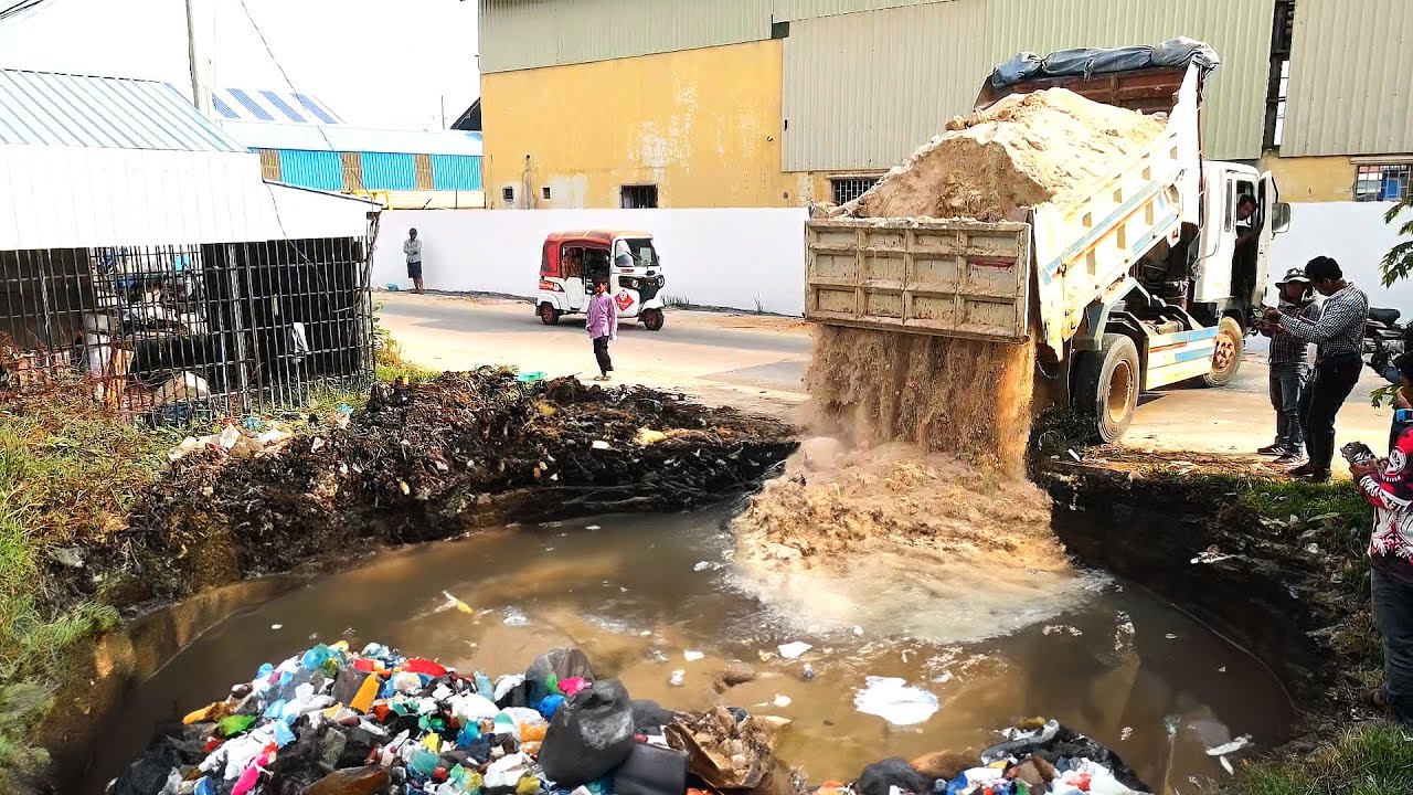 Very Cleaver Work To clear garbage flooded pond, support by Komatsu D20A Bulldozer and Trucks