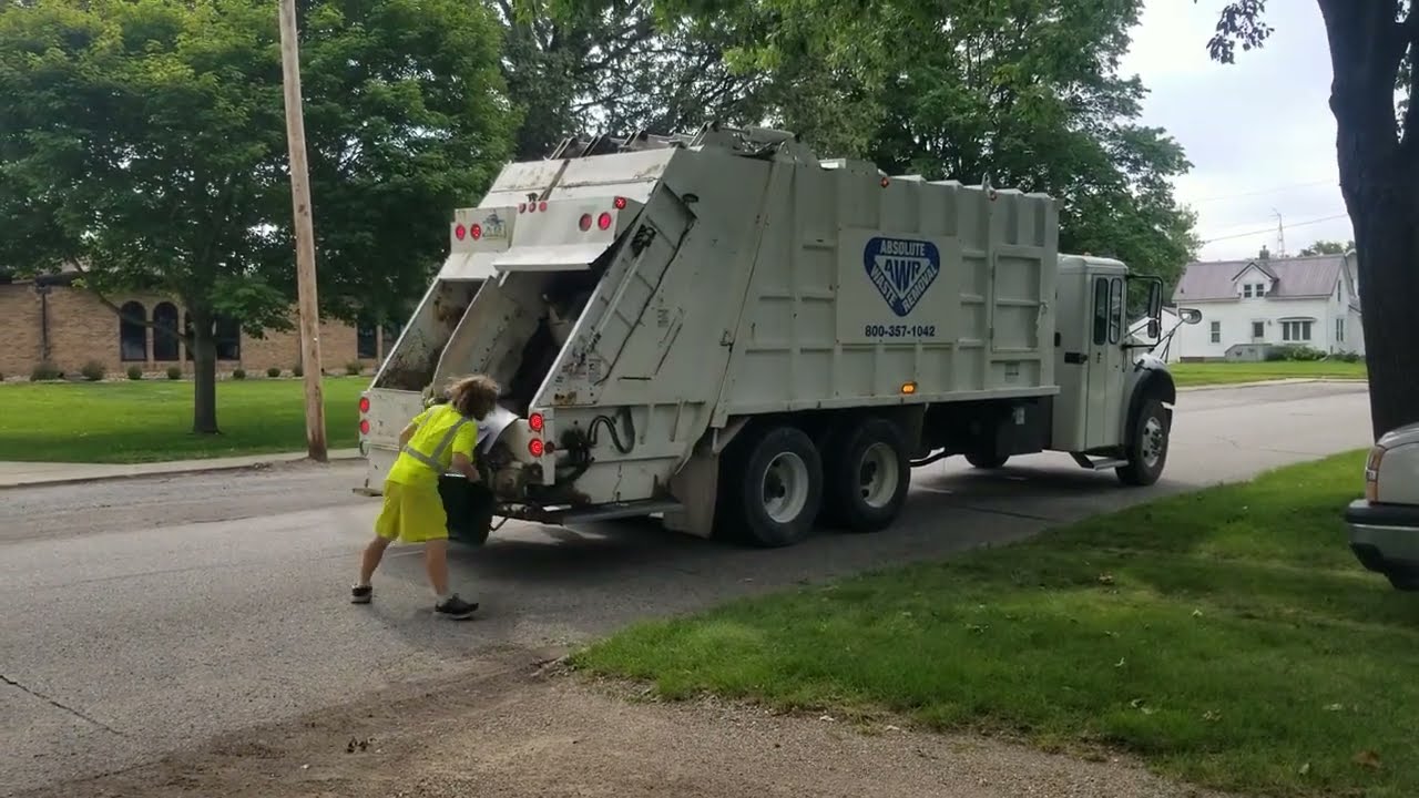 Absolute waste removal Freightliner split rear loader on manual recycle