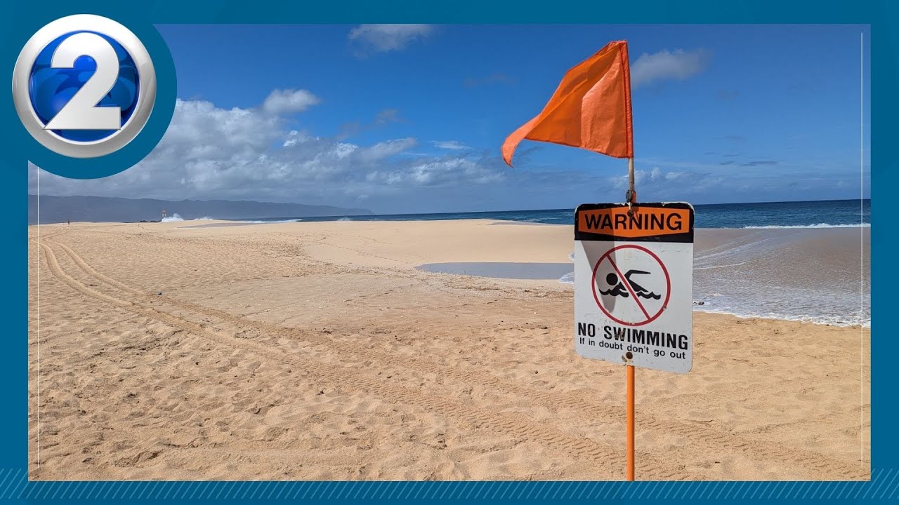 High surf warning in full effect, lifeguards rescue dozens on the North Shore