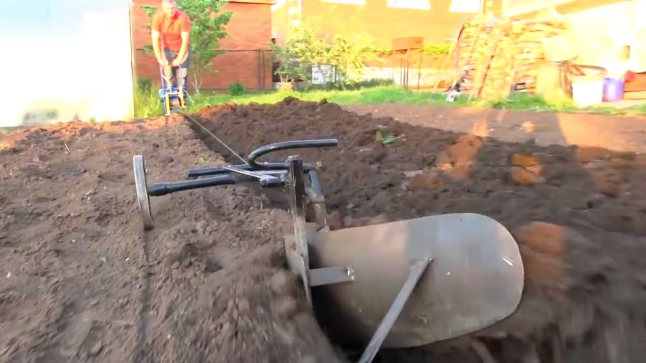Plowing the soil with a winch: a video compilation