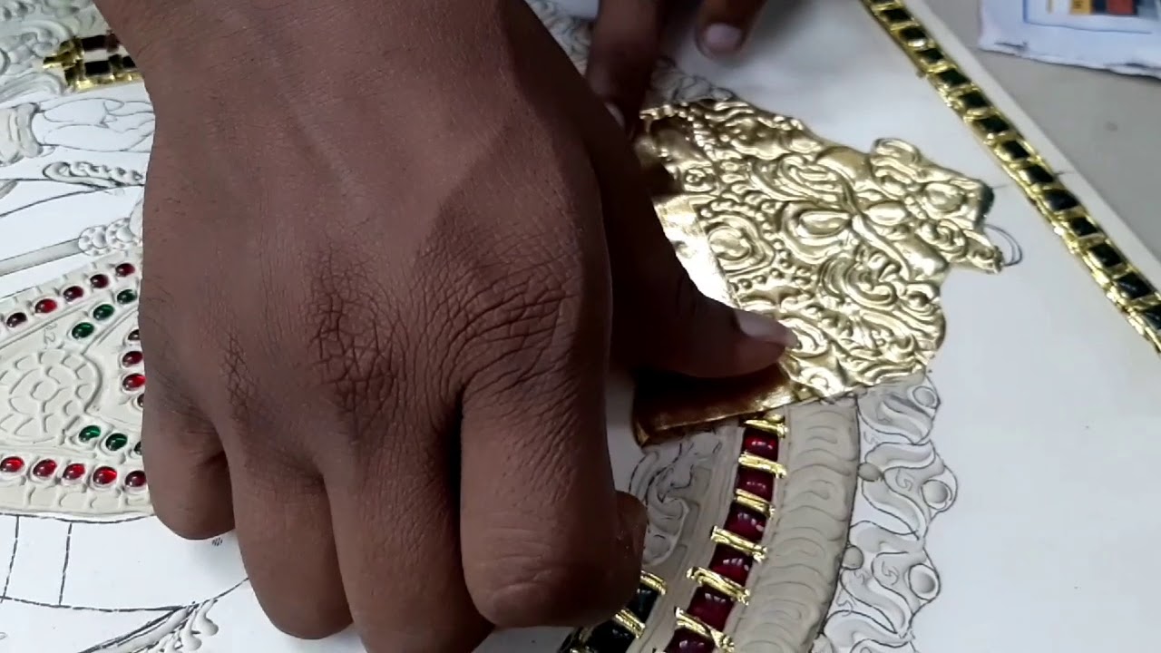 TANJORE PAINTING STICKING THE GOLD FOIL