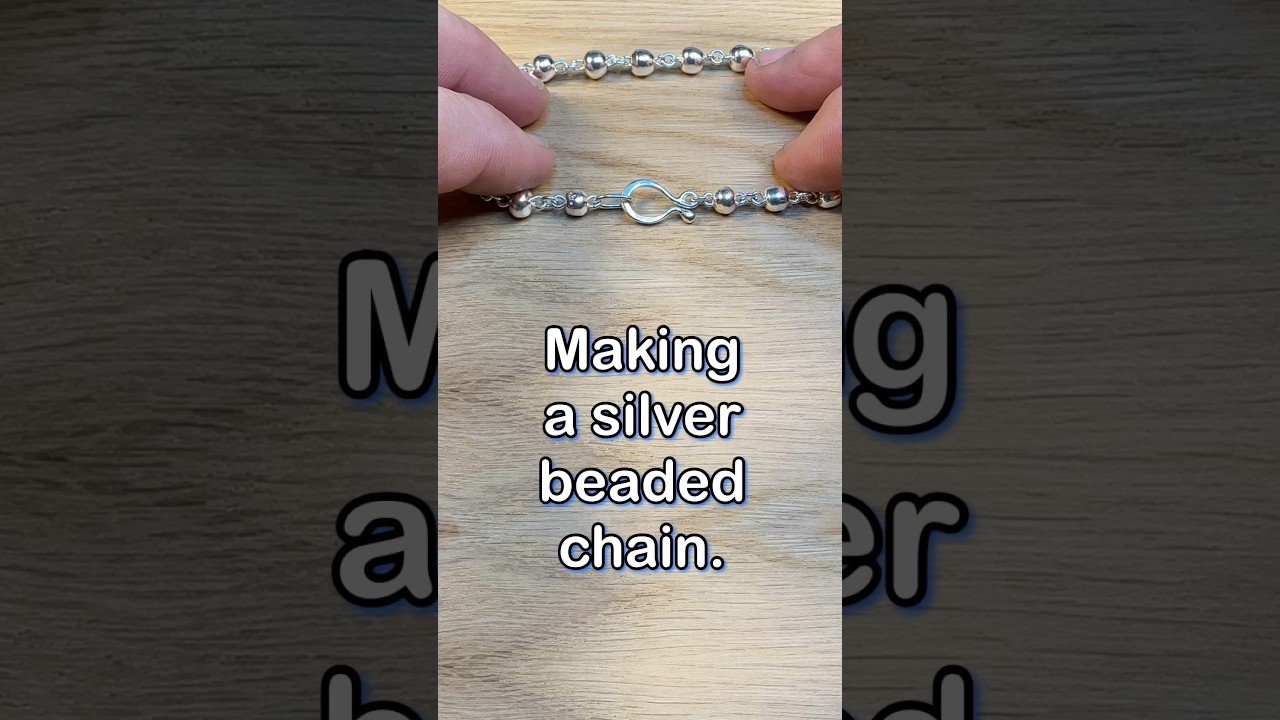 Making a silver bead chain.