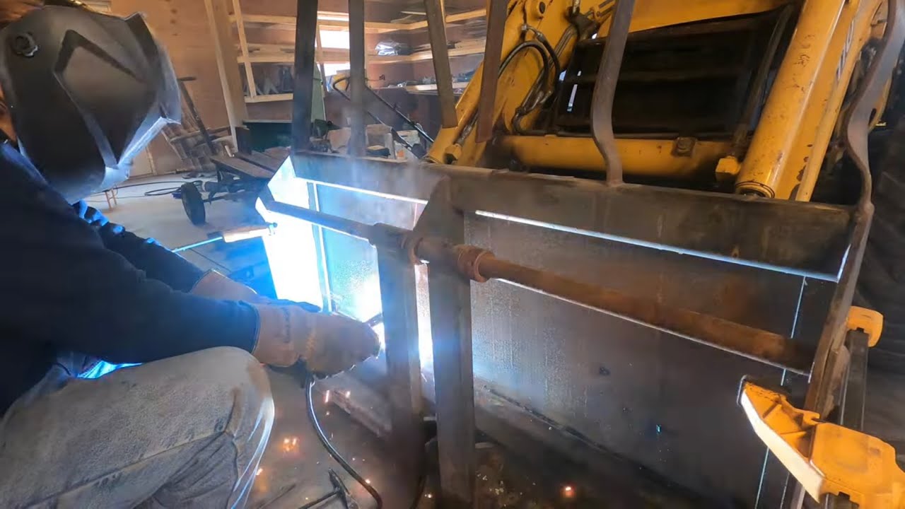 Welding up forks for the backhoe and then breaking them