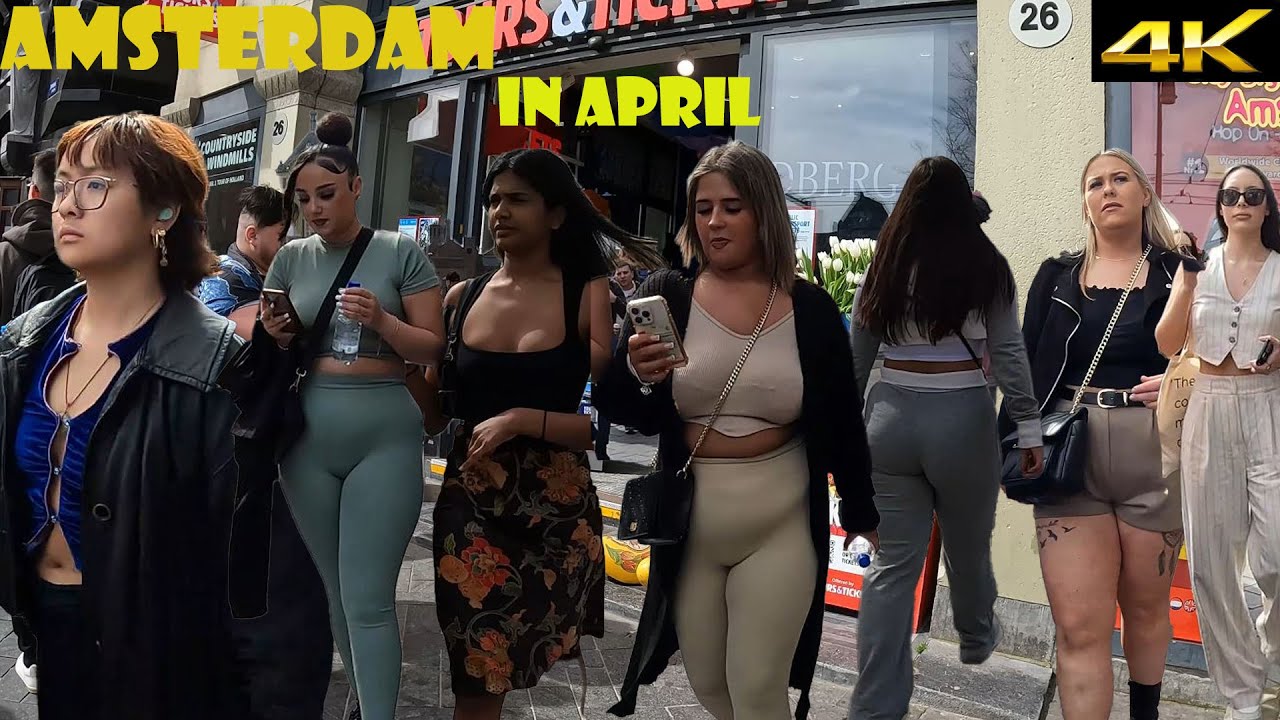 April 2024 in Amsterdam. Walking tour at Damrak. Crowded with Tourists