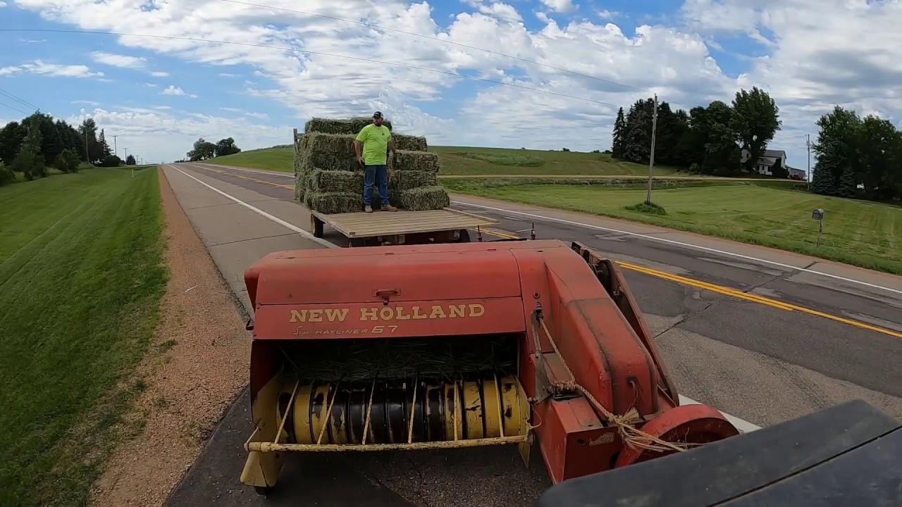 Raking hay with the Farmall M and some small square baling