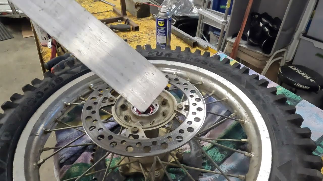 Honda dirt bike wheel bearing retainer removal WITHOUT  special tools