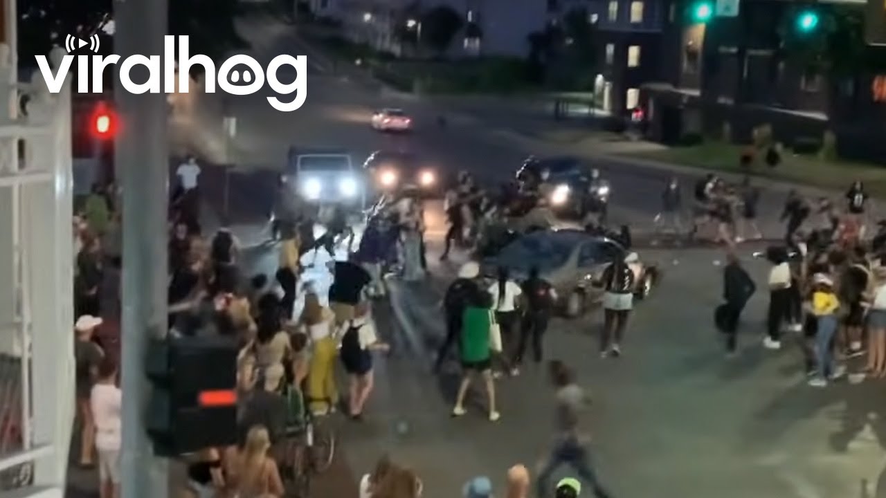 Car Drives Through Protesters Blocking Iowa Intersection || ViralHog