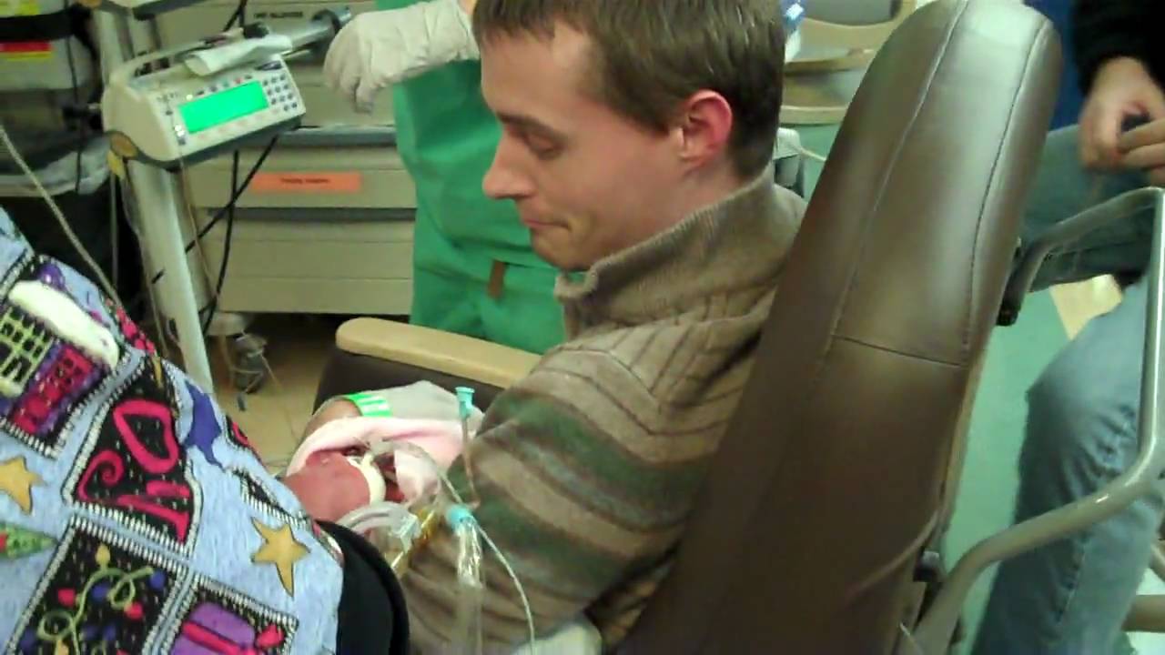 Dad holding Millie for the first time