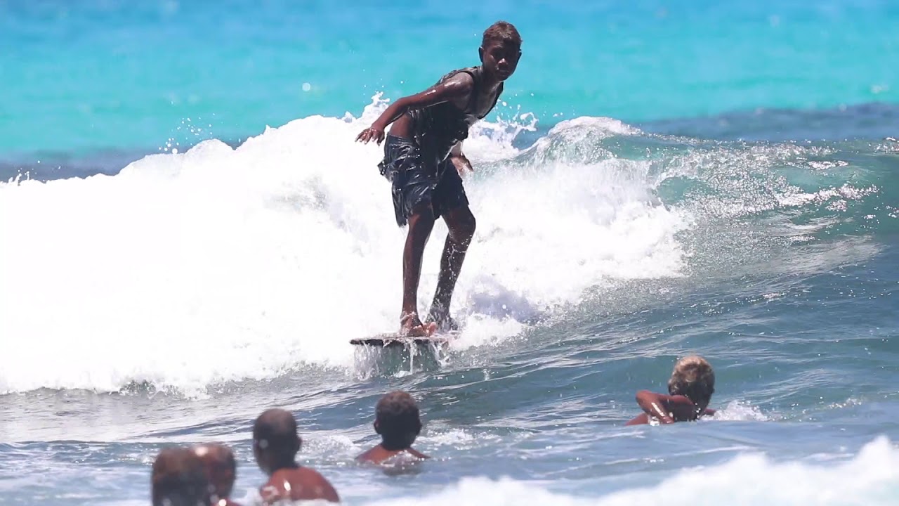 Solomon Island Kids Surf on Planks of Wood