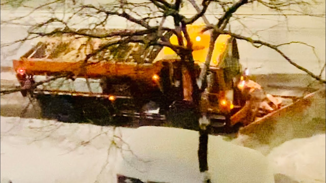 DSNY SALT SPREADER TREATING & PLOWING STREETS DURING MAJOR WINTER STORM ORLENA ON IN MANHATTAN, NYC.