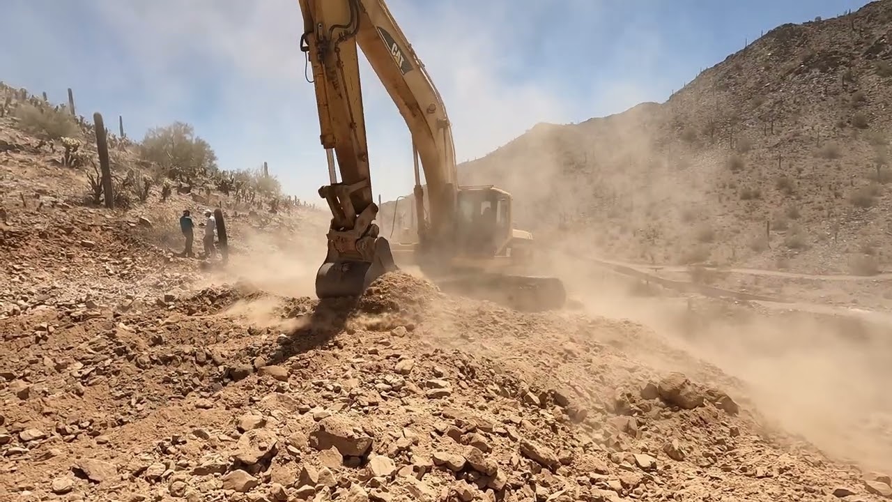 CAT 330BL Excavator Digging in the Desert