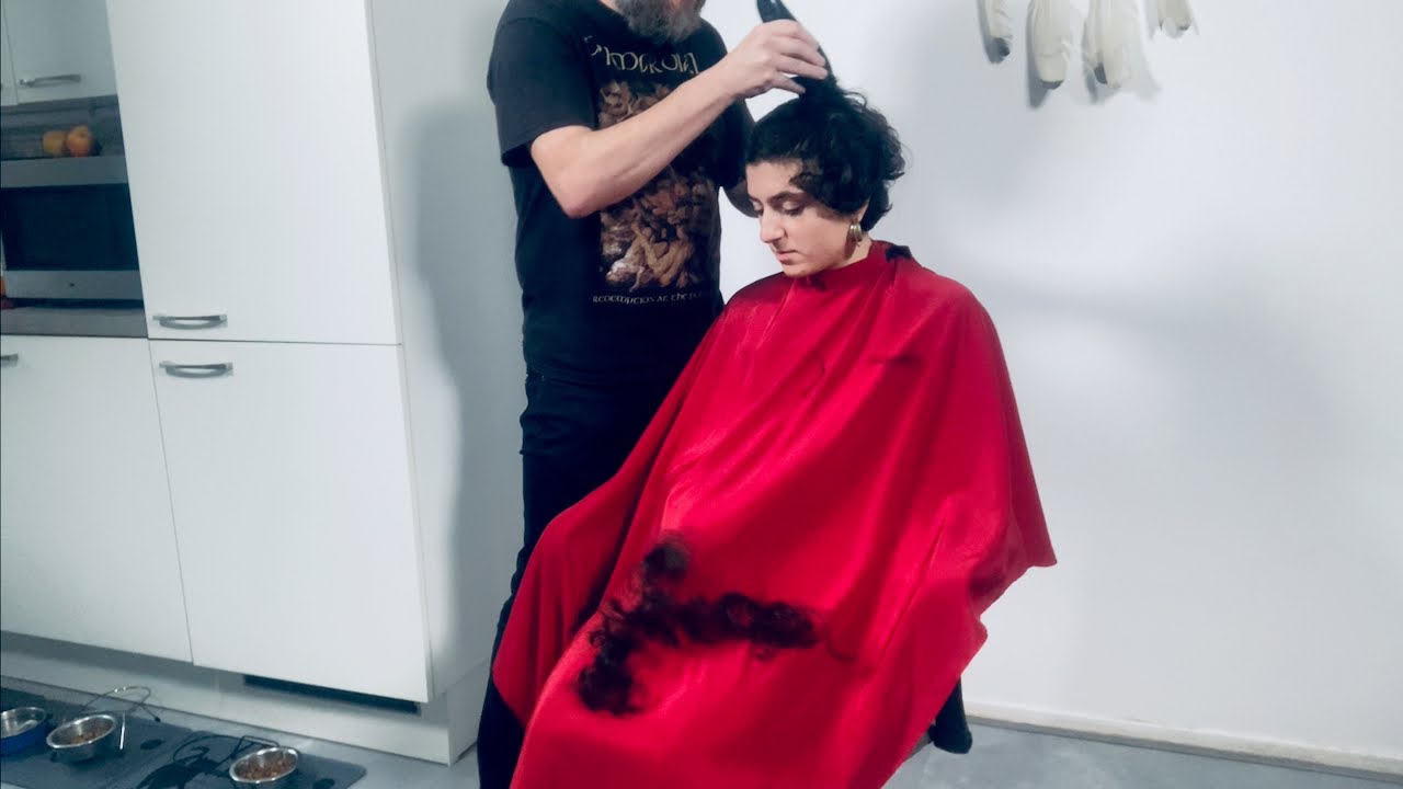 A stunning buzzcut haircut! This girl gets her curls shaved off with clippers and rocks short hair!
