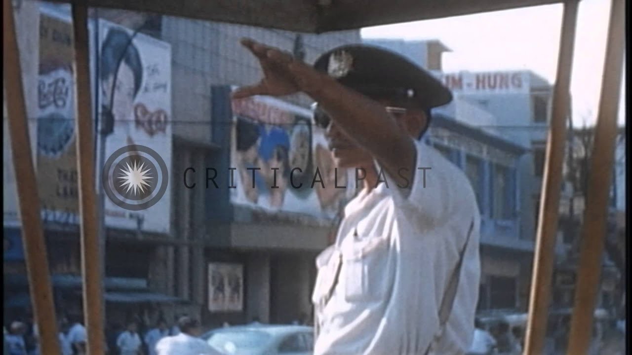Capitol Military Assistance Command Operations Center and traffic on road in Saig...HD Stock Footage