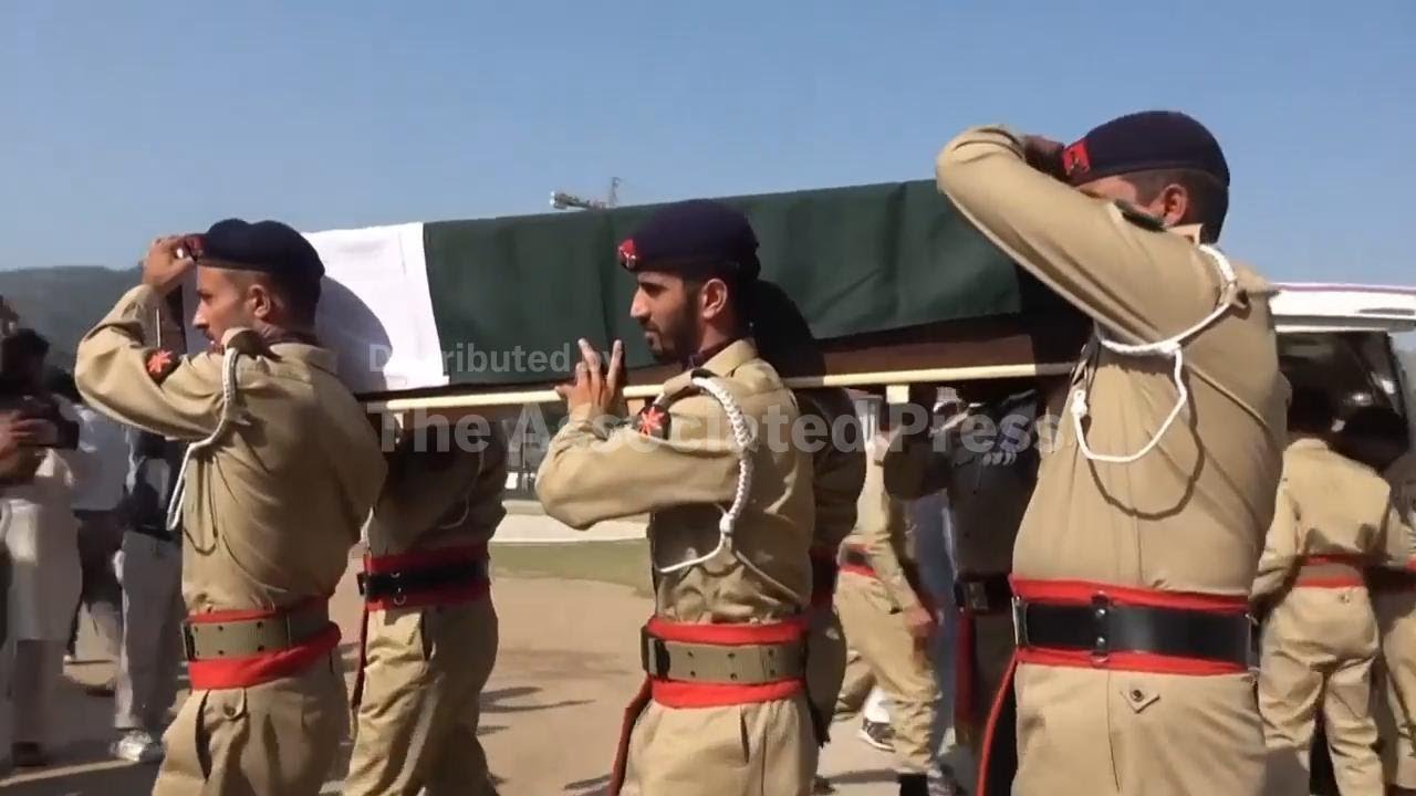 A mass funeral is held for 22 Pakistani soldiers who died in a helicopter crash in Kashmir
