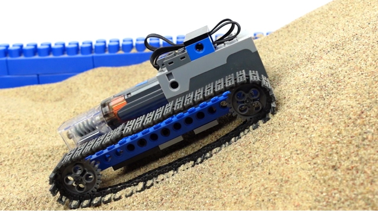 LEGO Tracked Vehicle Crossing a Sand Obstacle