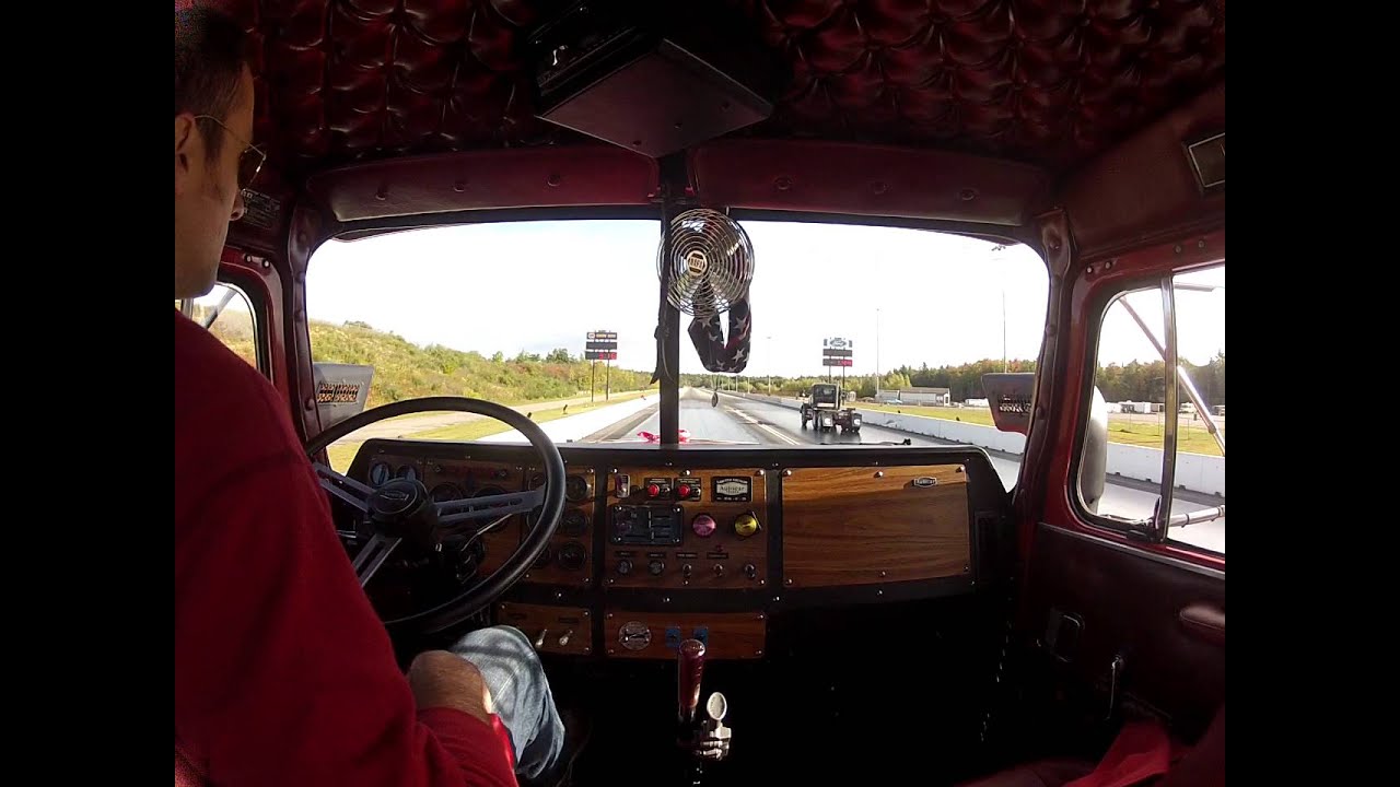 Two Autocar trucks drag racing