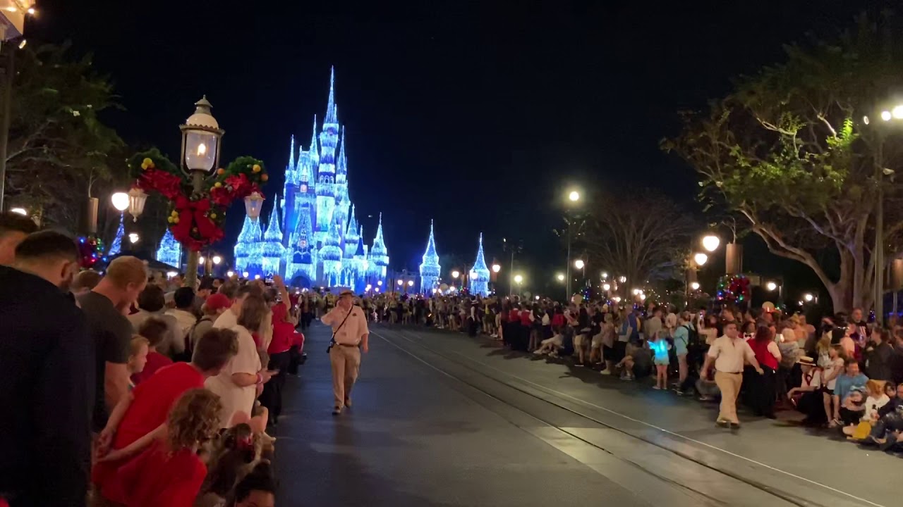 The University of Michigan Marching Band parades on Main Street at Disney’s Magic Kingdom