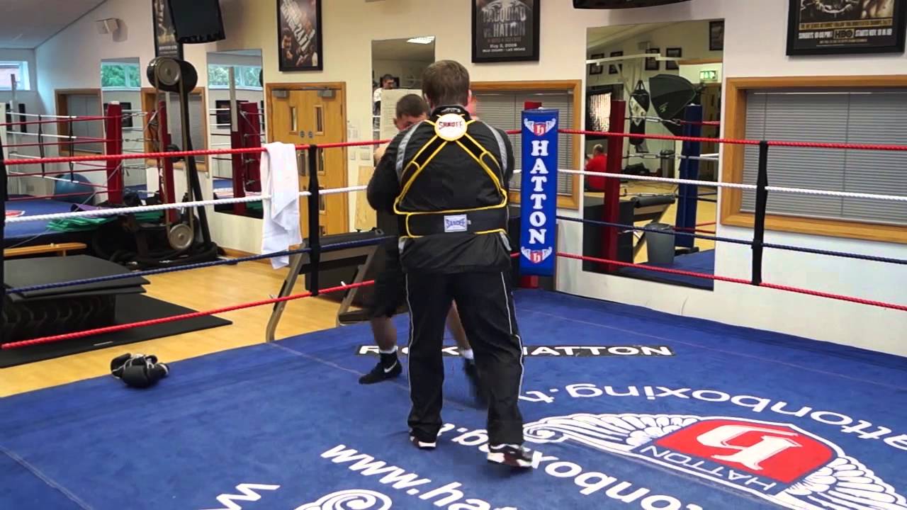 Ryan Burnett on the pads with trainer Ricky Hatton