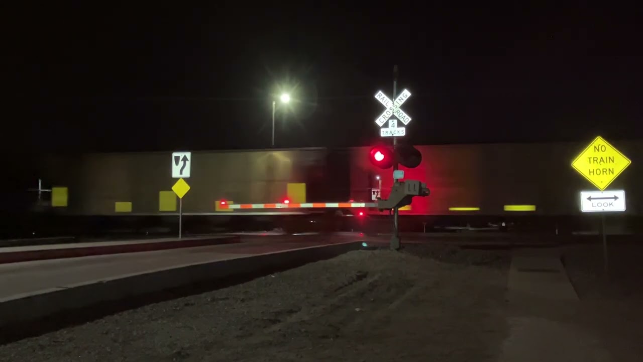 UP AC4400CW leads Coal Train w/ 6 Locos including DPUs East, 5th Ave. Railroad Crossing, Kearney NE