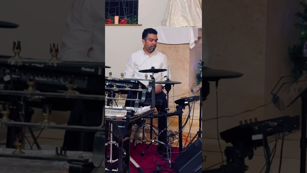 Drumming at Christmas Eve Mass at St.Francis of Assisi Church, Halstead,England,UK 