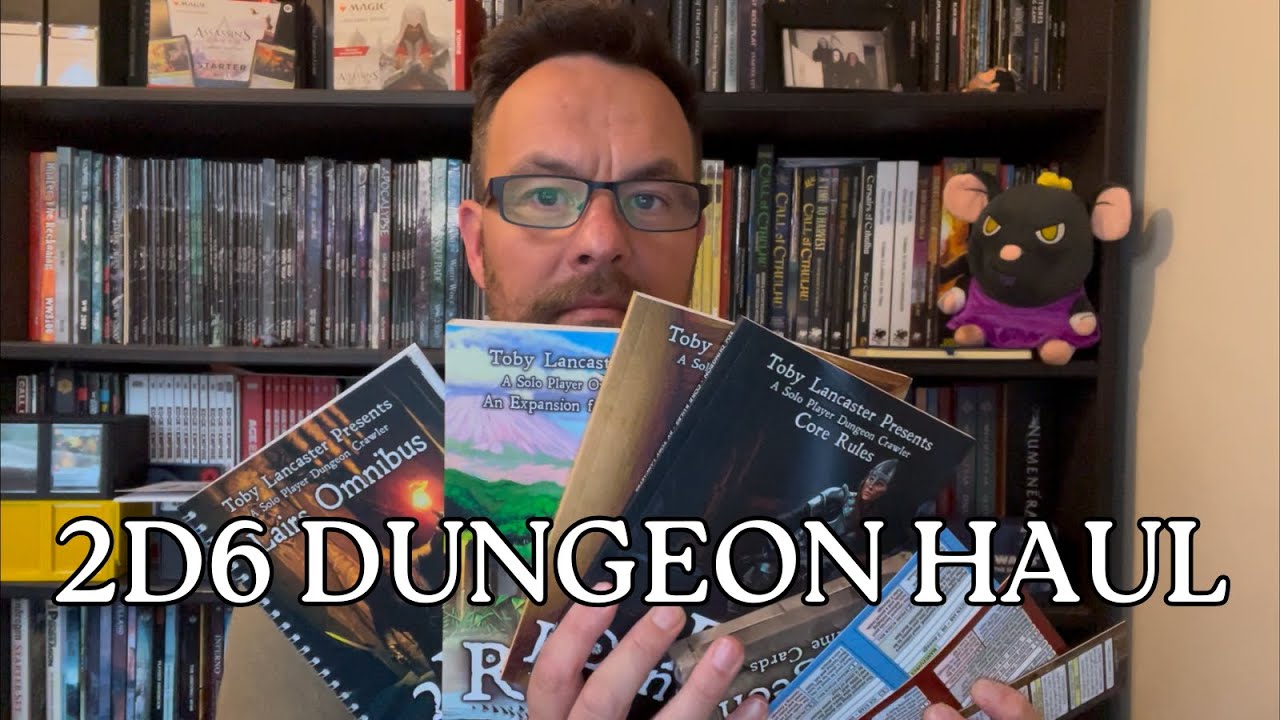 My first look at 2D6 Dungeon books and card packs