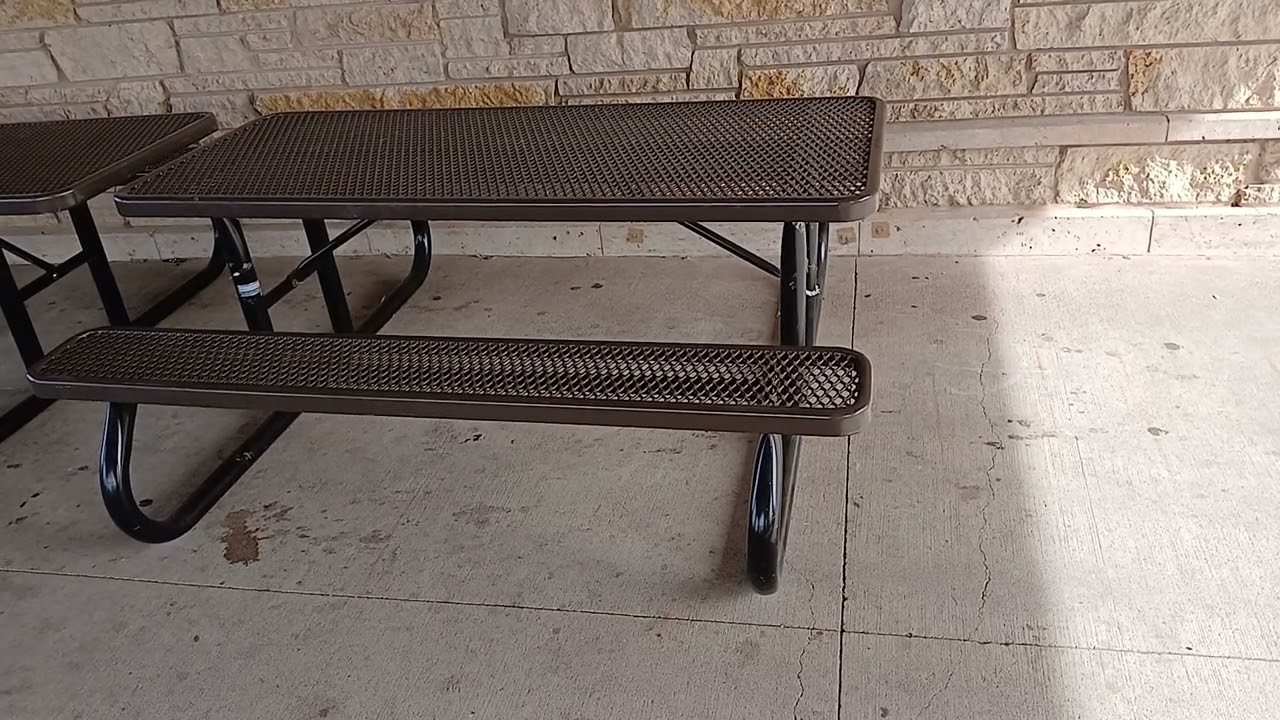 Picnic tables under a shelter at a park in Iowa in Fall Autumn. 