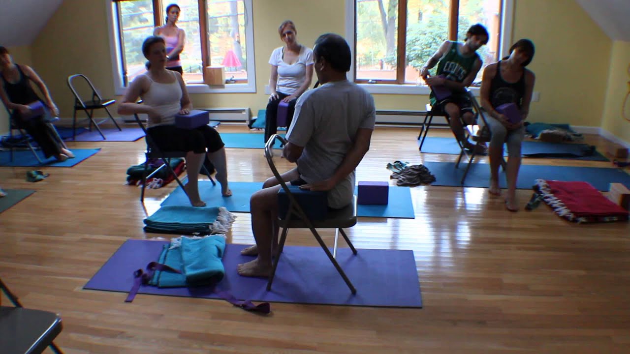 Sri Arun H.S. demonstrating Bharadvajasana using a chair