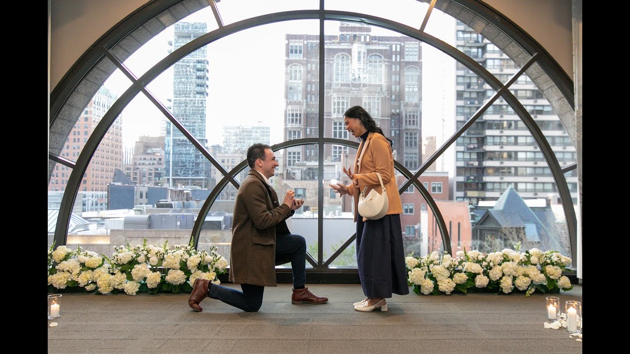 Luke & Emily&rsquo;s Romantic Thompson Chicago Proposal | Floor-to-Ceiling Window Backdrop