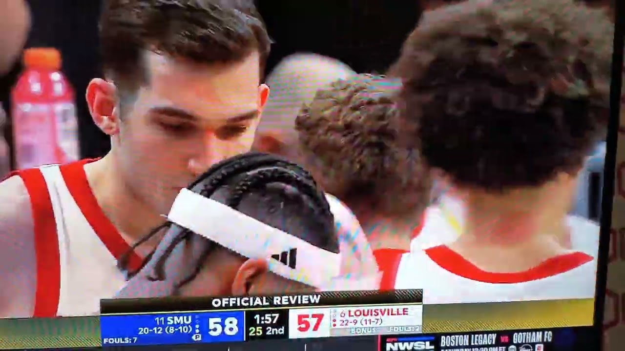 Louisville player goes all out in an effort to sell a foul on SMU. It didn't work though. 😄