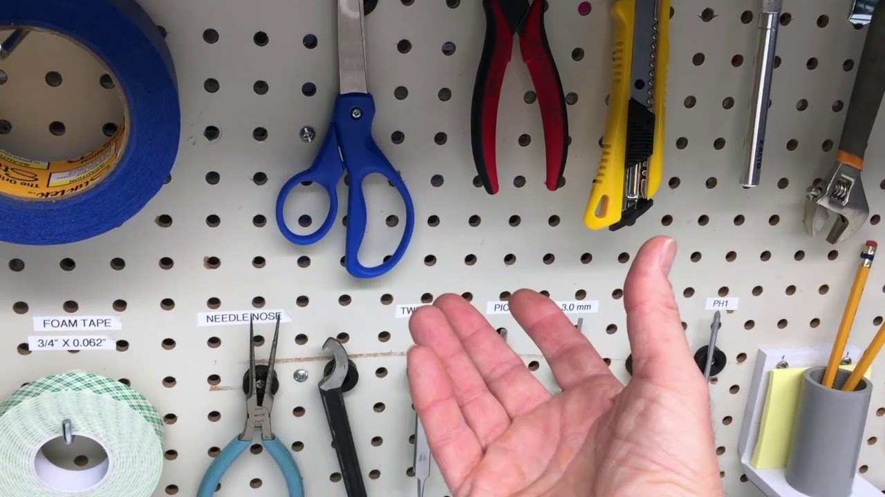 Rubber coated MAGNETS for pegboard organization.  Countersunk hole.
