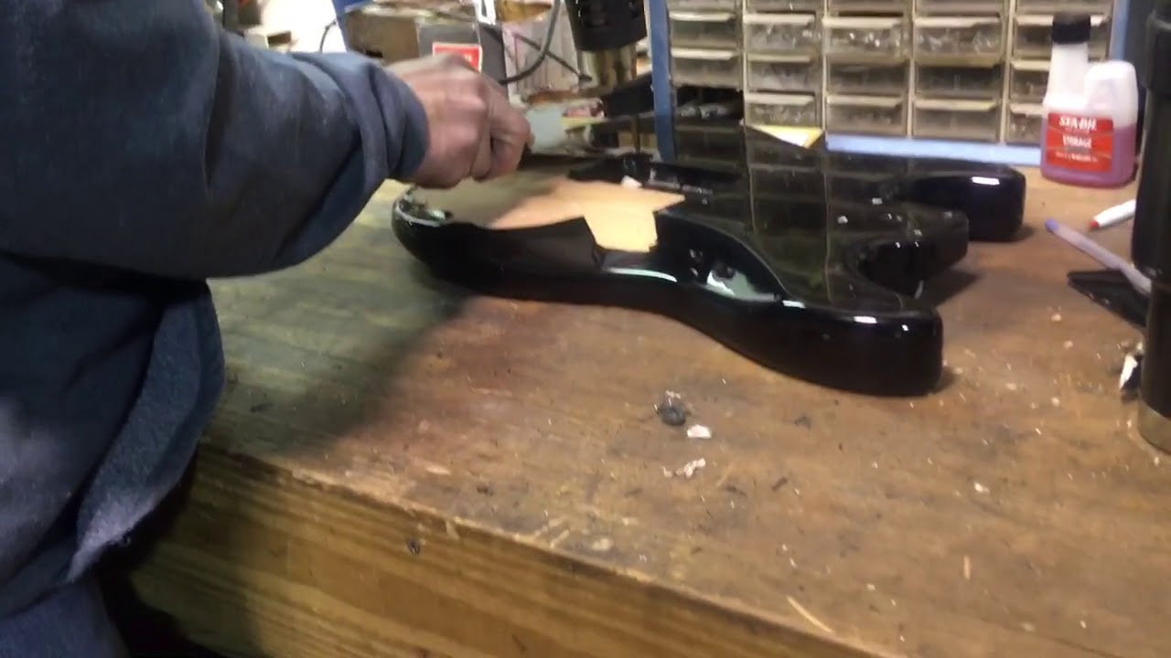 Removing paint from a guitar body with a heat gun