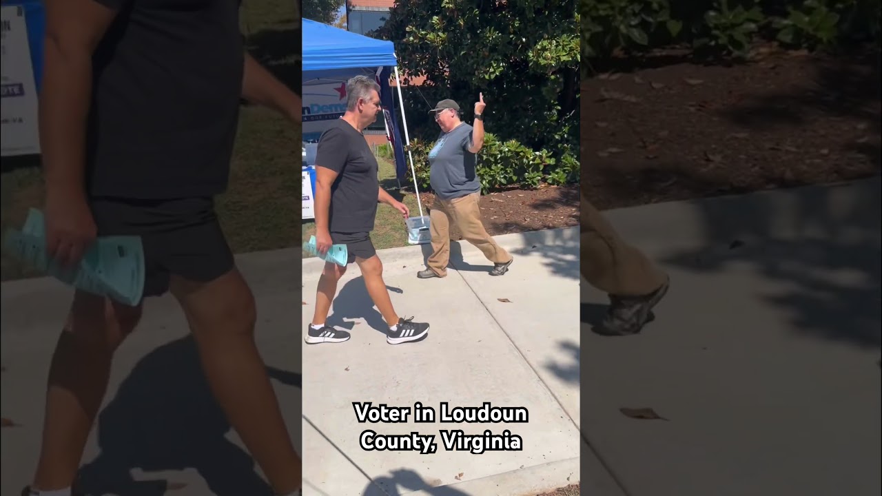 Loudoun County, Virginia voter gives “the bird” to Republican volunteers. 