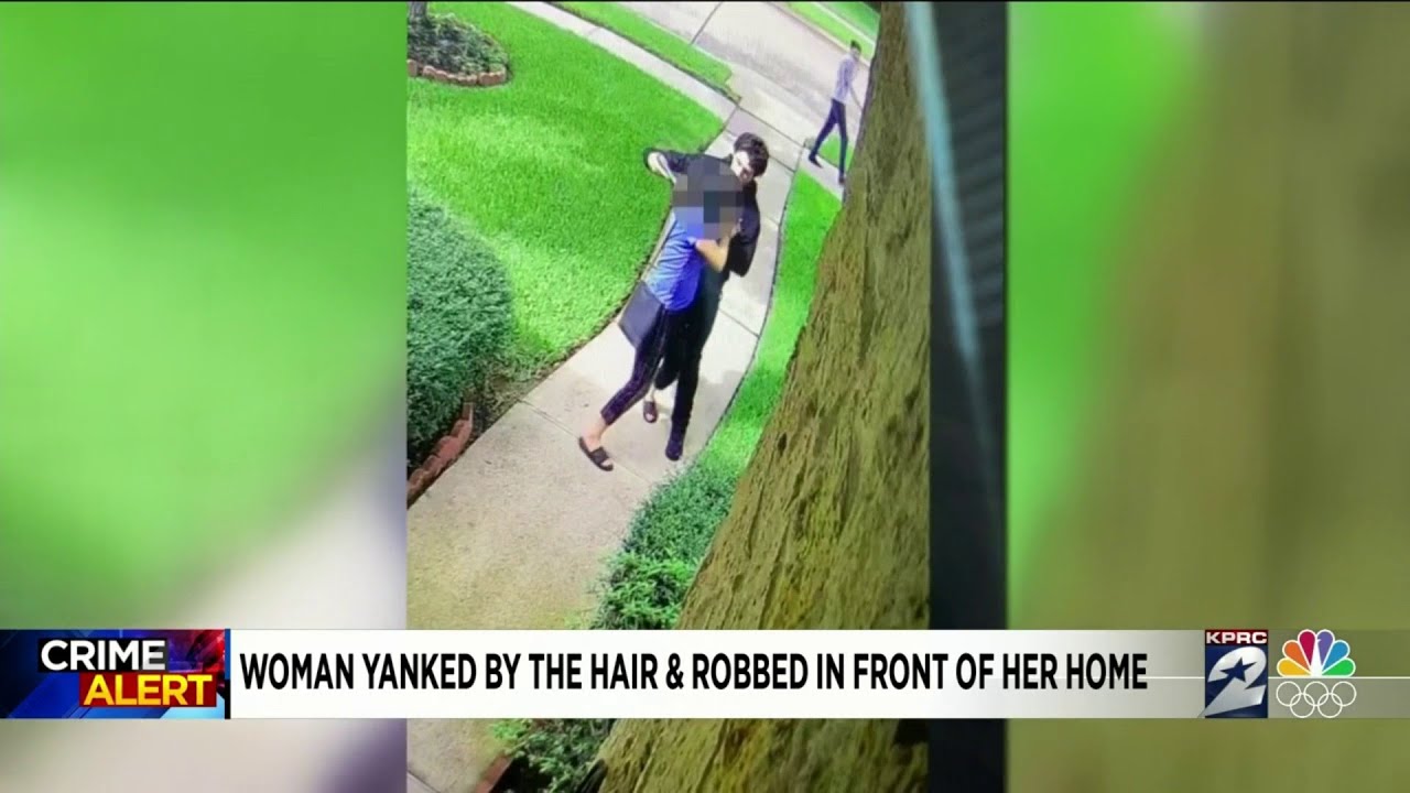 Woman yanked by her hair and robbed in front of her home