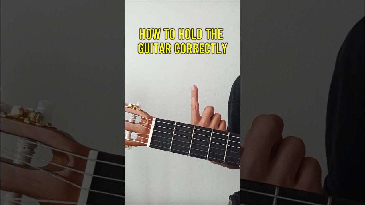 How to hold the guitar correctly 🎸❔ #guitar #guitartutorial