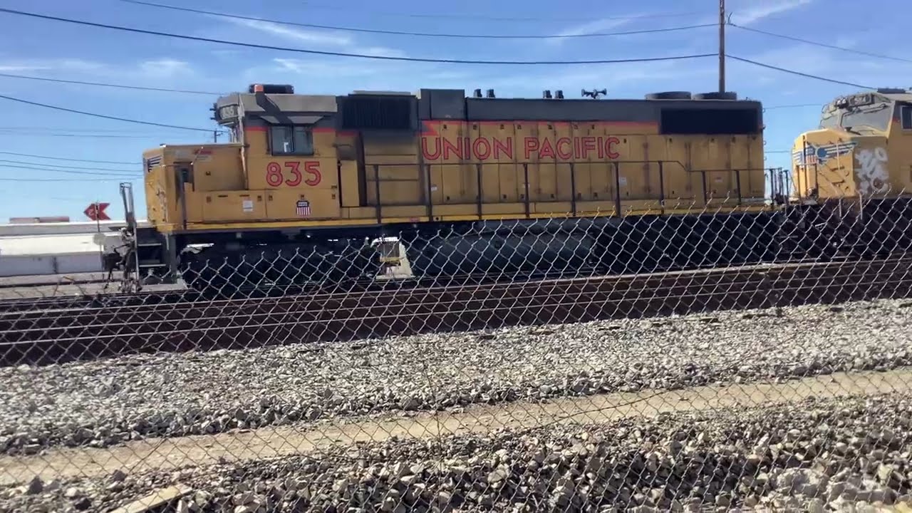 UP 835 GP38 pulls toward the 16th St bridge and stops for a switch at Phoenix yard