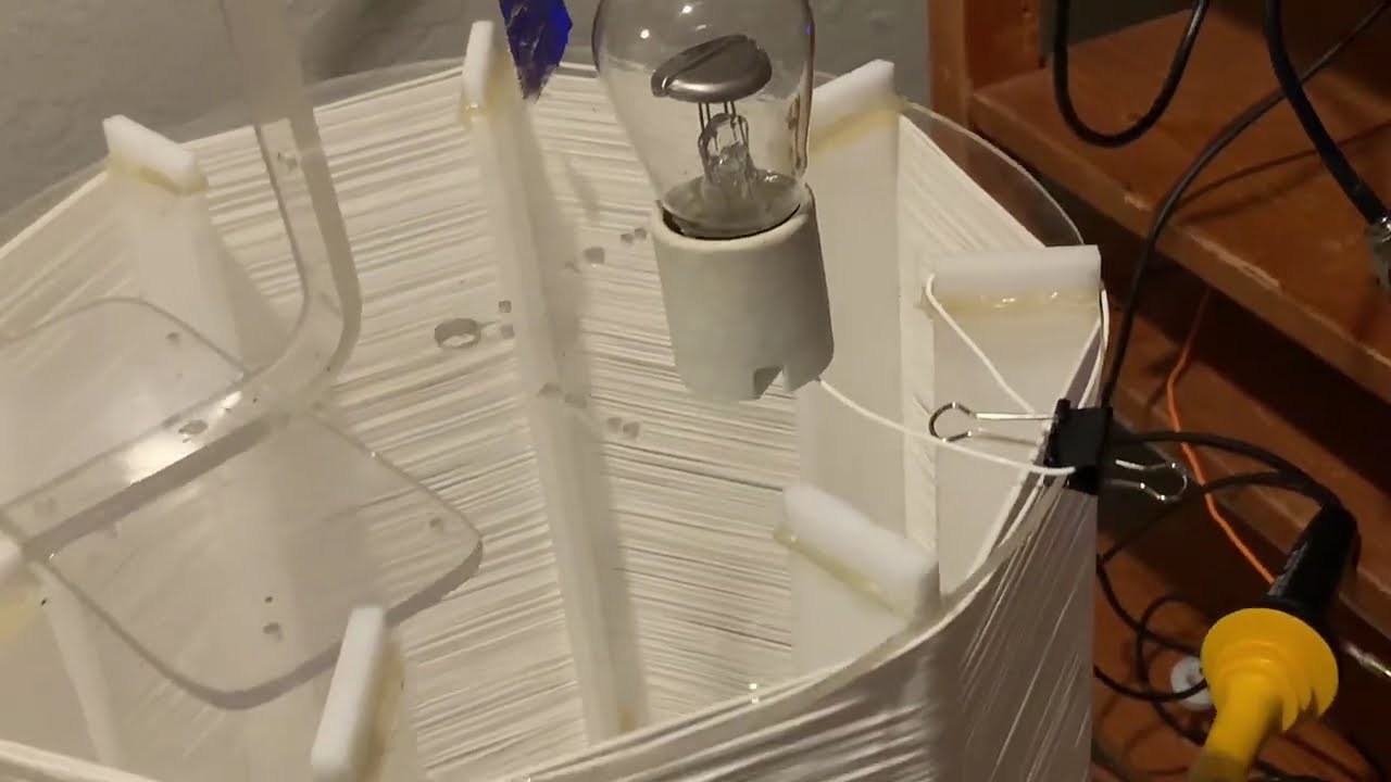 Tesla Coil Phenomena: Capacitive Coupling, Electrostatic Attraction of Aluminum Foil to Radiant Bulb