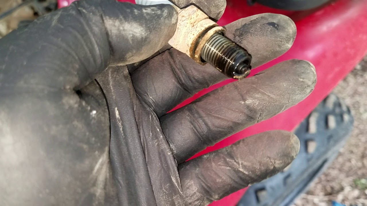 2001 Kawasaki Prairie 300 4x4 spark plug change location and tools needed