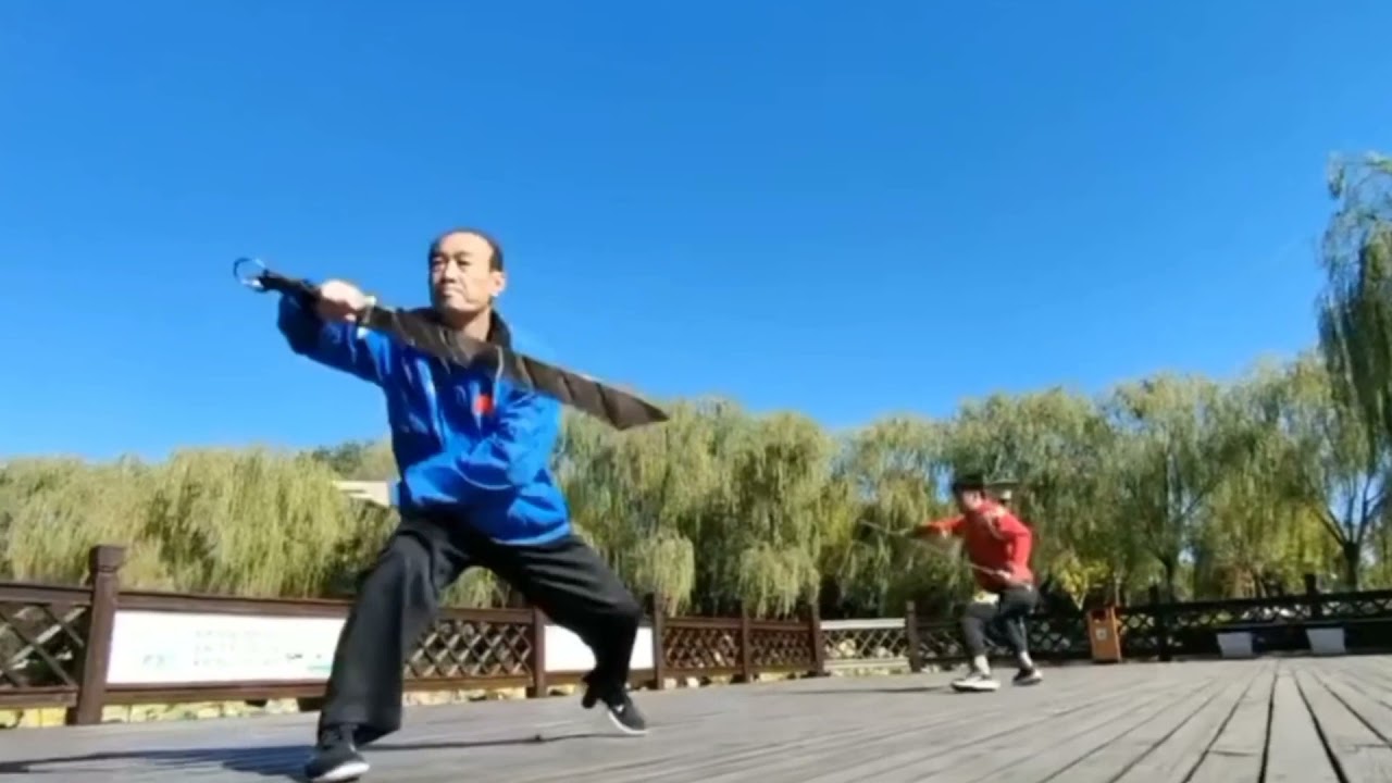 Bajiquan duilian. A short stick against Jiu huan da kandao.