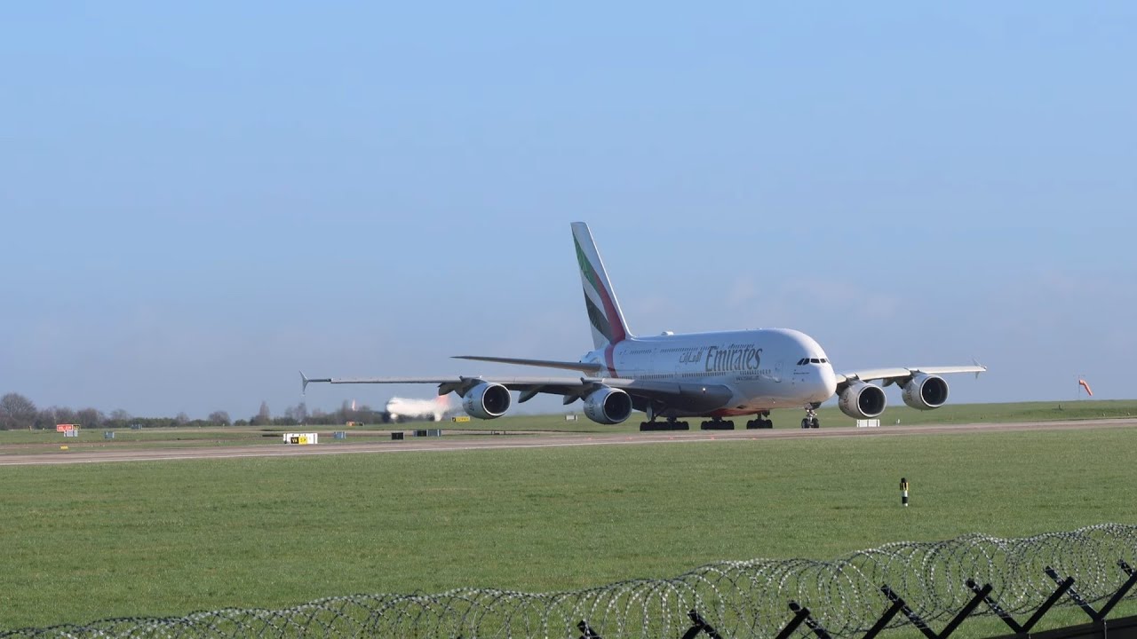 Departures of Emirates A380 and Qatar 777