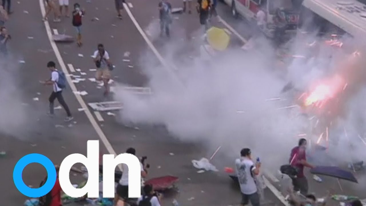 Hong Kong police disperse pro-democracy protests with tear gas
