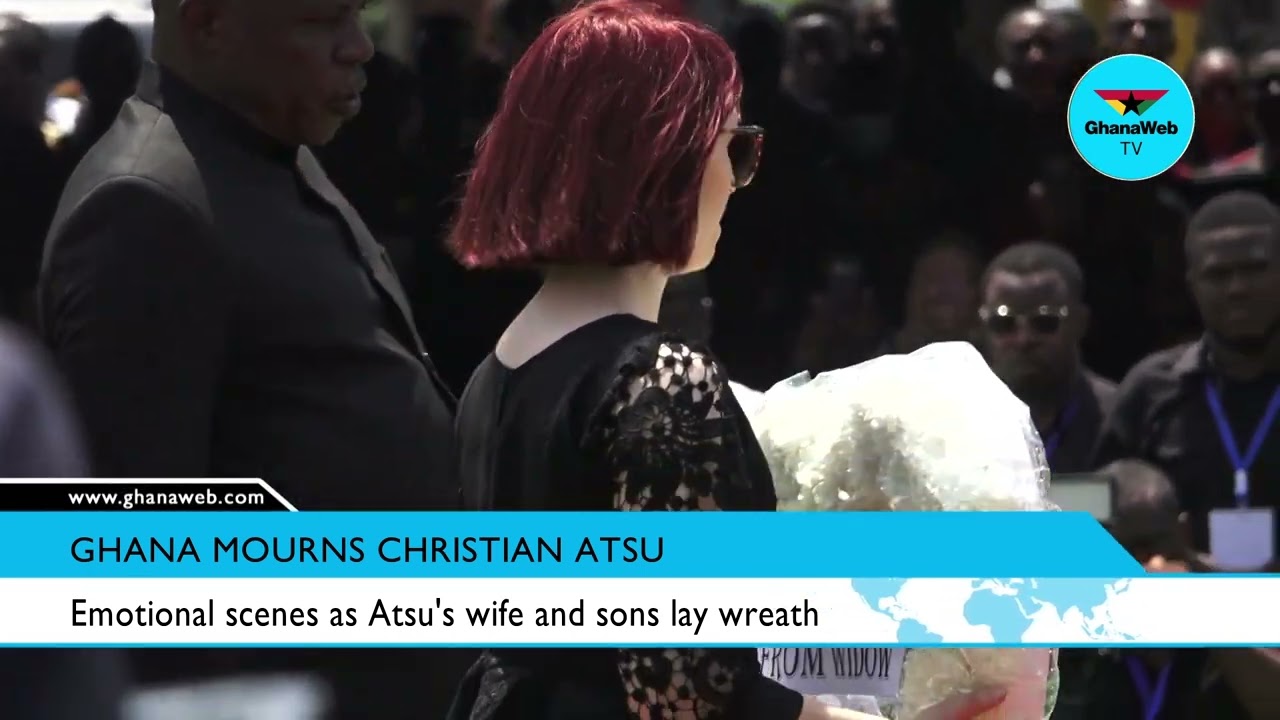 Emotional scenes as Atsu's wife and sons lay wreath at his funeral