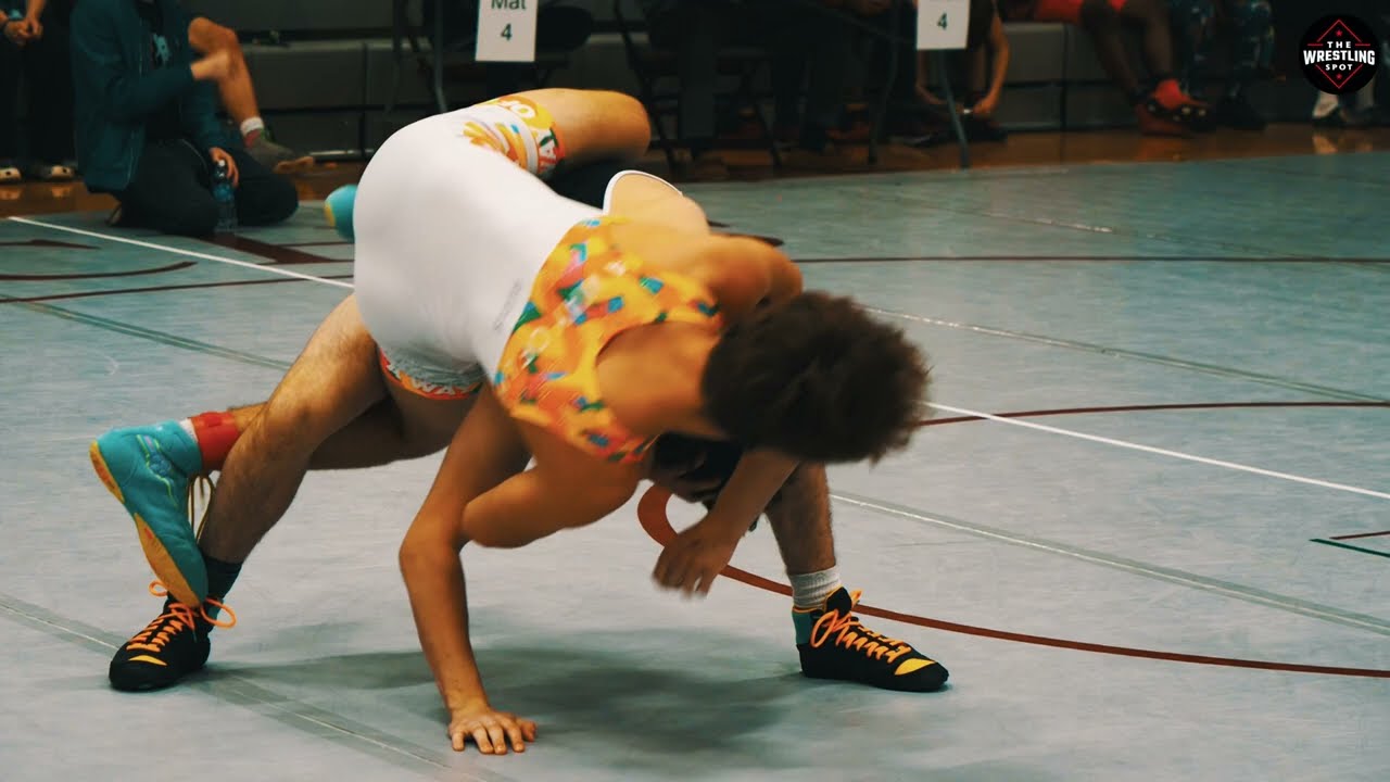 Owen Anderson of Toss Em Up Wrestling Academy [R] and Braden Wood of Monticello [G]