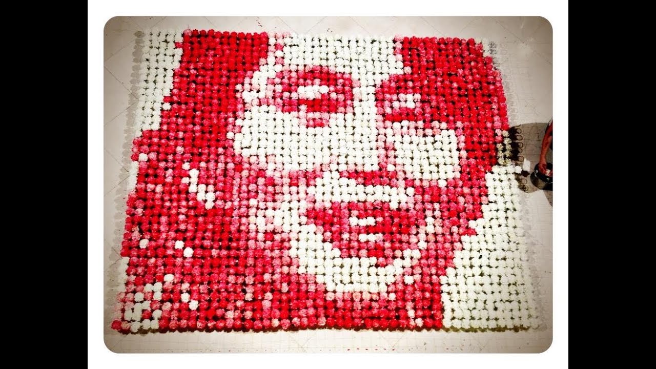 Aung San Suu Kyi Portrait with 2000 white flowers and red dye by Red Hong Yi