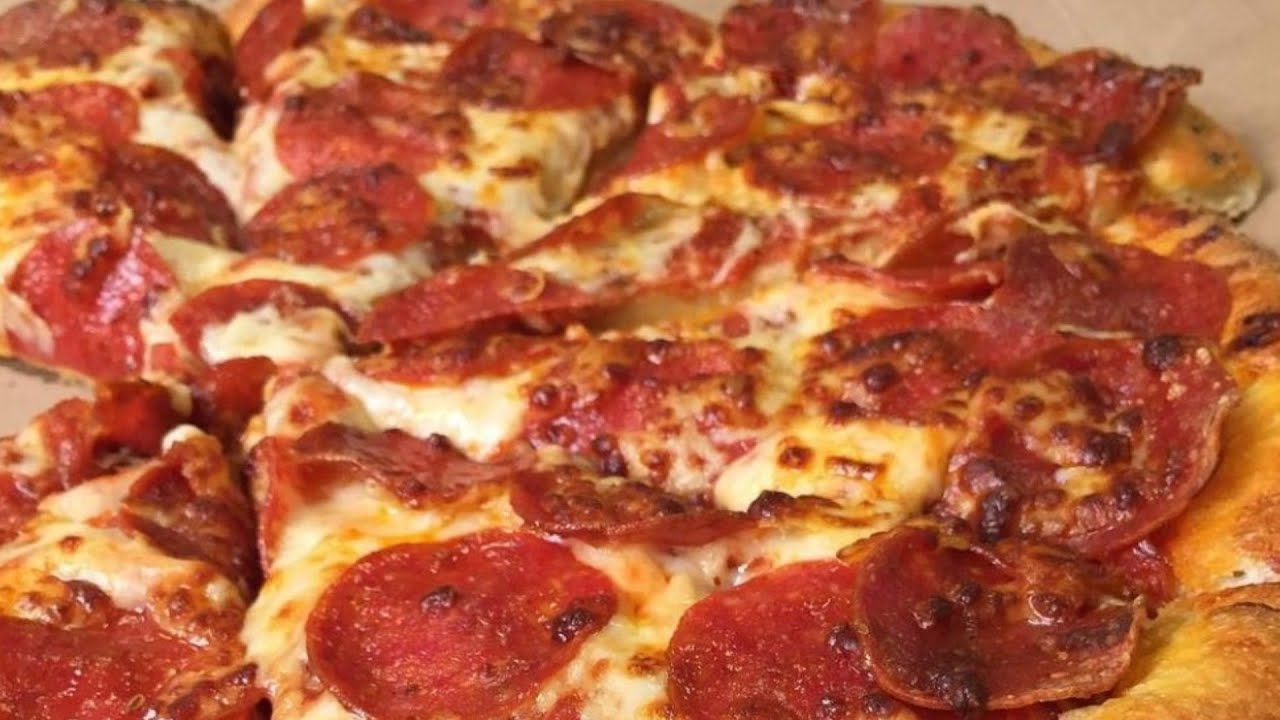 The Real Reason Domino's Pizza Is So Cheap