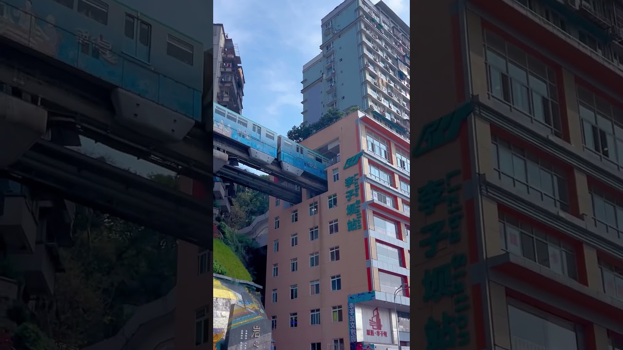 Chinese metro train passing through residential building in Chongqing