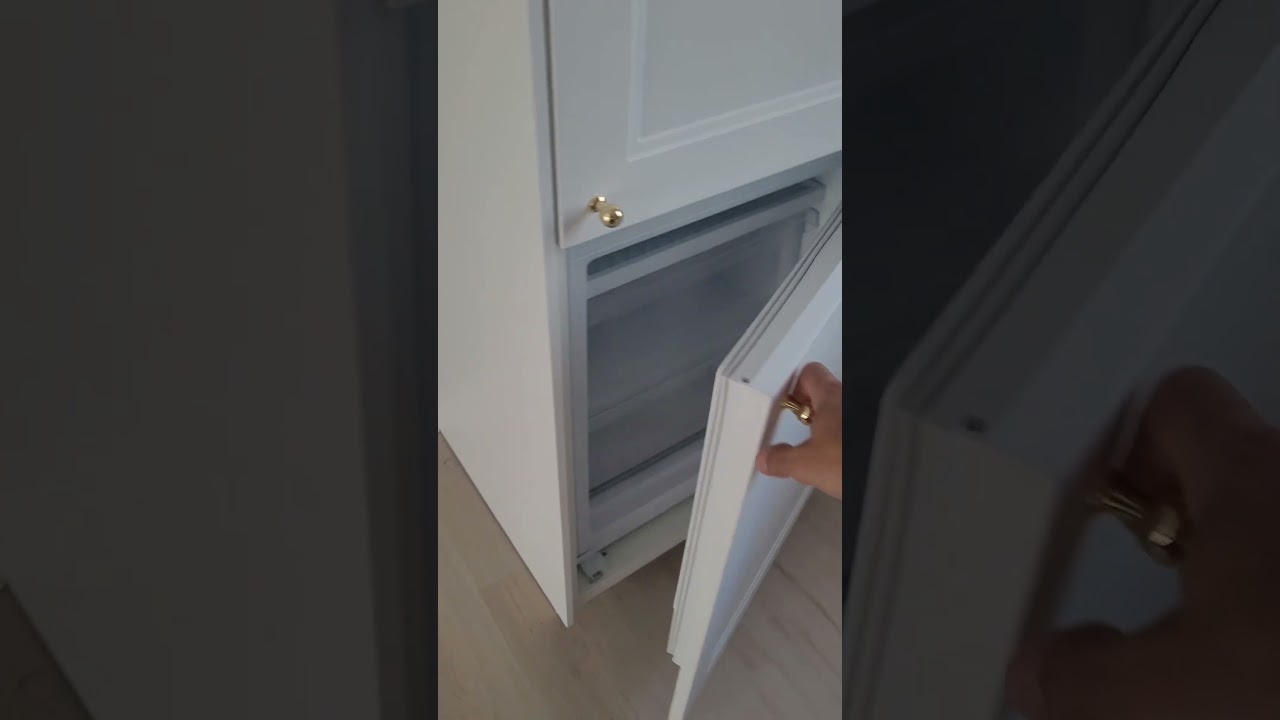 IKEA Panel ready built-in refrigerator, 24 in wide. Brought by European Kitchens, the IKEA installer
