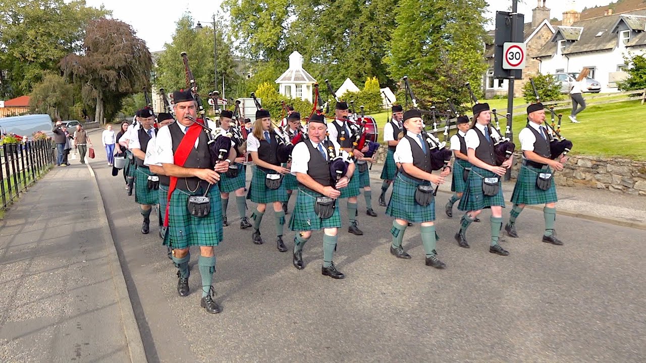 Mairi's Wedding & Brown Haired Maiden set as Newtonhill Pipe band march through Braemar in Scotland