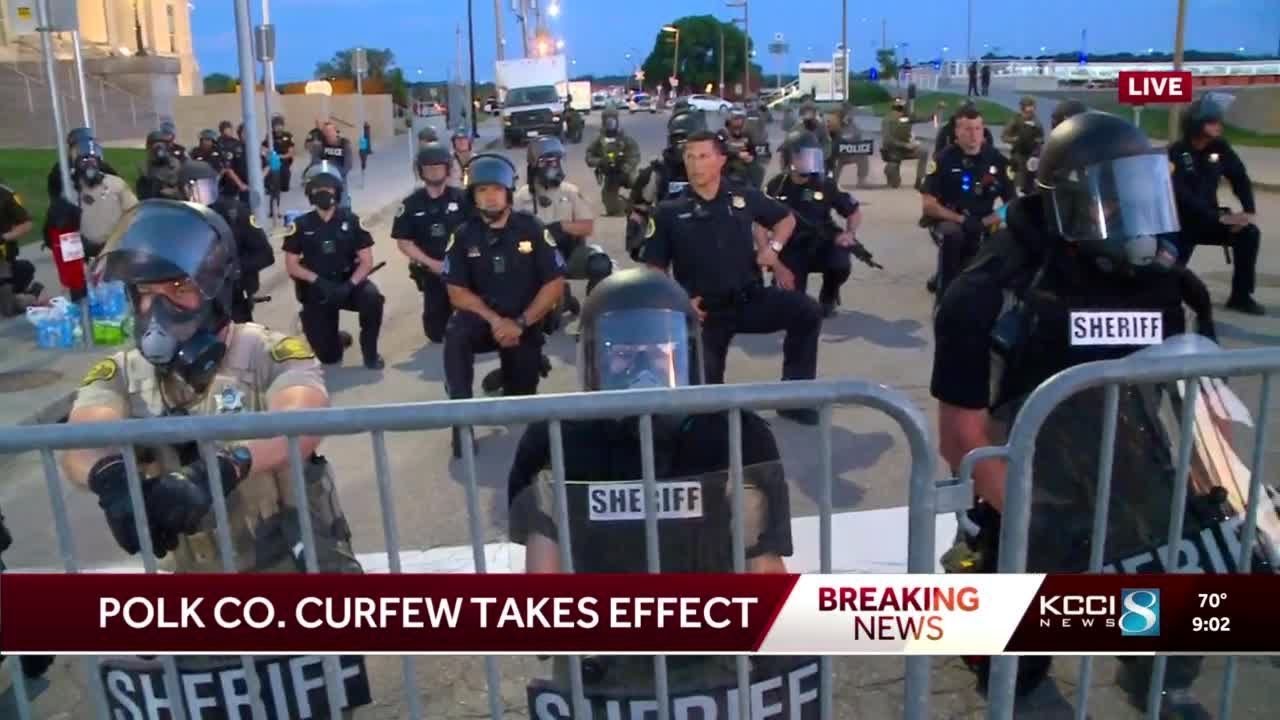 Police take a knee with protesters