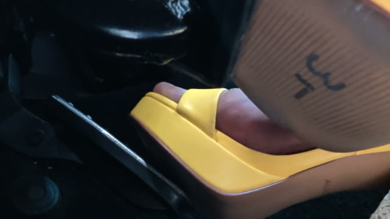 Driving with high heels under the pedal view 